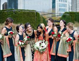 bride and wedding party laughing 
