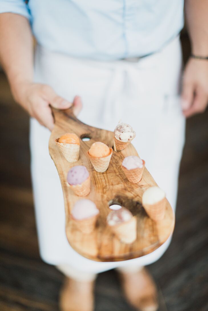 We're totally on board with these mini ice cream cones—ice cream is timeless! In addition to their wedding cake and "hers" and his" cupcakes, Jennifer and Jason had these tiny treats for their guests, passed in wooden paddles. Yum!