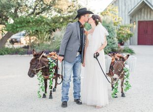 A leaf-strewn aisle and antler motif lent an autumnal aesthetic to Carly Seymour (28 and a student) and Adam Richards’s (34 and a general contractor) 