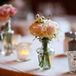 Spray Rose Centerpiece in Bud Vases with Tea Light Candles