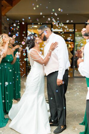 Couple Kisses During Bubble Grand Exit at Stone River in Columbia, South Carolina