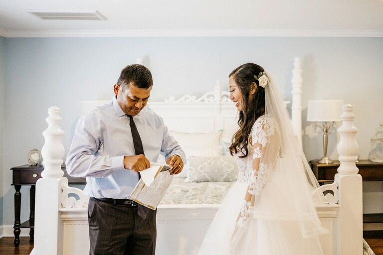 Bride giving her father a wedding-day gift
