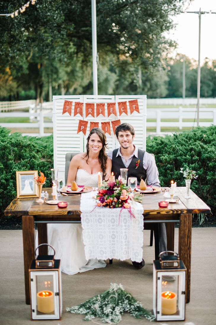 Shelby and Zack's rustic sweetheart table was made entirely by Shelby and her father. The finished wood table matched their guests’ seating with a sweet lace runner, tealight candles and even mini fall-inspired arrangements from 2Birds Events. But there was one distinct difference. “My abuela [grandmother] had just gone into the hospital the week of my wedding,” Shelby says. “So I had her photo on our table to show her that she made it to my wedding.” How sweet is that?