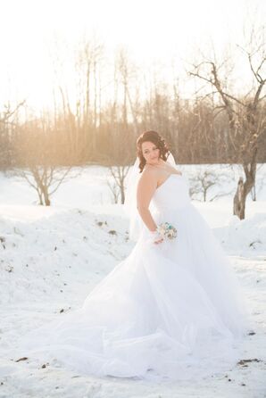 Bride in an Alfred Angelo Disney Collection Wedding Dress