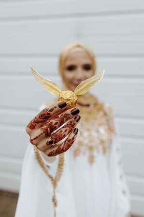 Bride Holding Harry Potter-Inspired Snitch at New Jersey Wedding
