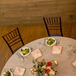 Gray Round Dining Table With Brown Chiavari Chairs