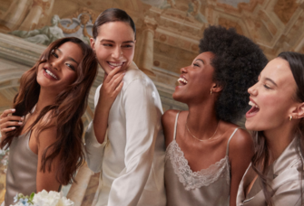bridal party smiling together getting ready