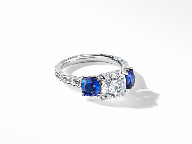 A diamond flanked by two blue sapphires.