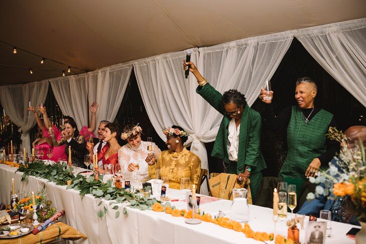 Long Head Table With Couple, Wedding Party With White Linen, Greenery and Flower Runner