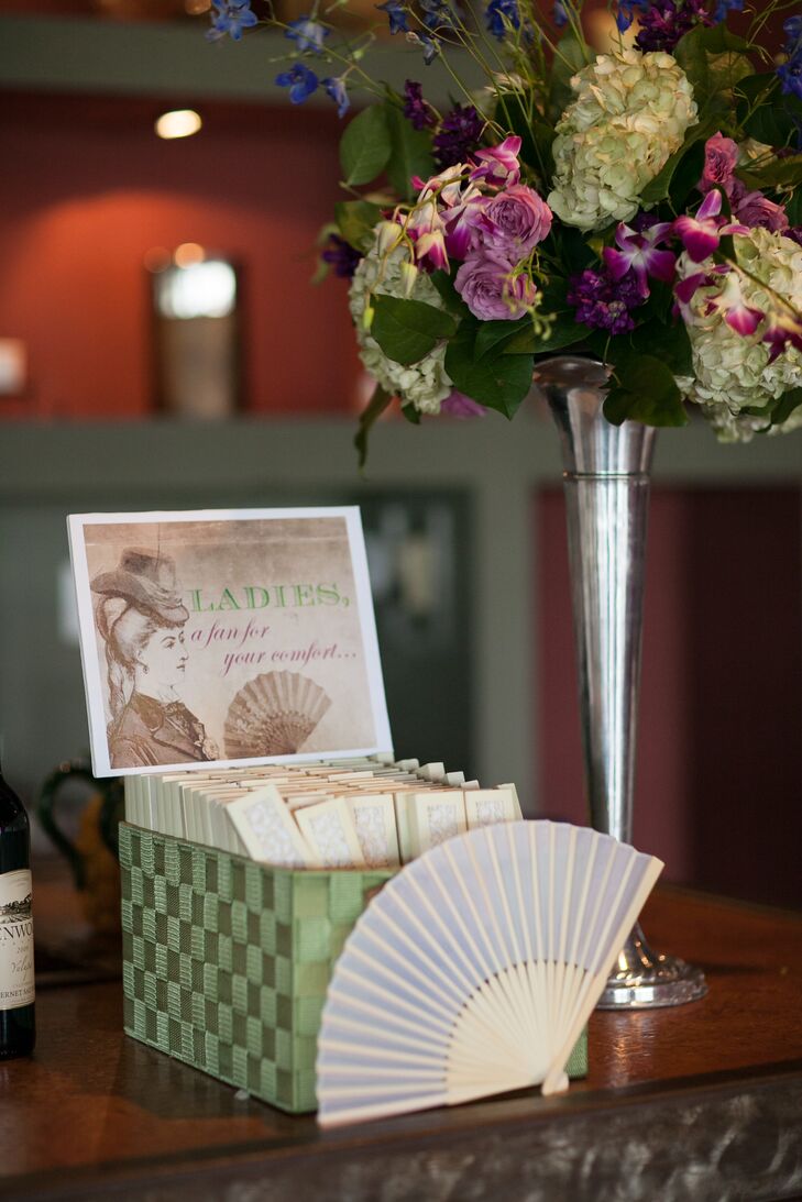 Keeping with their vintage theme, Lauren and Richard provided guests with handheld fans for the hot July wedding. The small fans were kept in a green box with a sign that read, "Ladies, a fan for your comfort."
