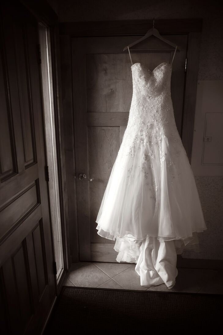 The bride wore a strapless, ivory gown by Mori Lee form the Unveiled Bridal Boutique in Thunder Bay.