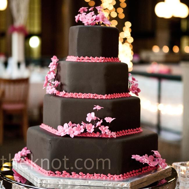 Though the bride grew up in Minnesota, the couple live in the Washington, DC area, so they covered their cake with sugar paste cherry blossoms.