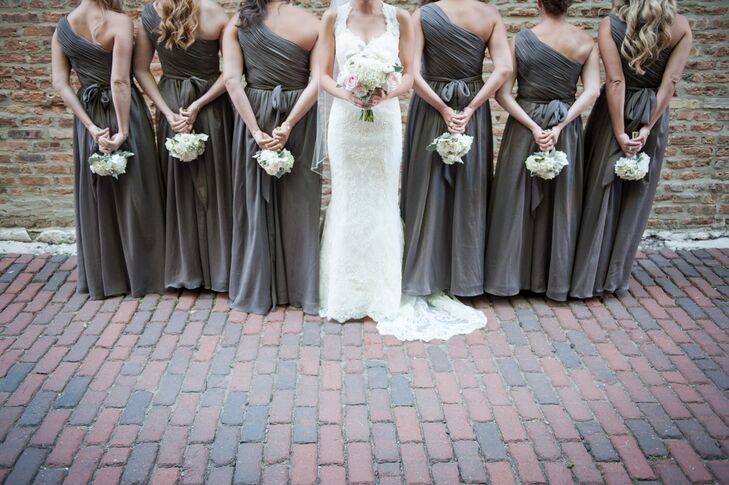 Each of Katelyn's bridesmaids wore a slate gray asymmetrical, floor-length dress.