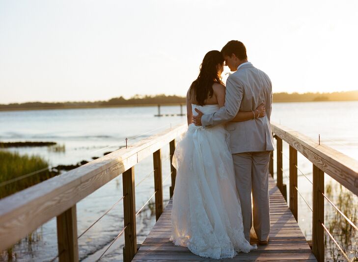 Kathryn looked like a true southern belle in a ball gown by Pronovias. The strapless gown featured a sweetheart neckline and flowing layers of embroidered lace organza. Cal wore a custom-made suit in a neutral color.