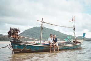 Couple Sitting on Boat in Water in Phuket, Thailand