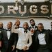 Groom in White Tux Jacket and Groomsmen in Black Tux Jackets With Bright Boutonnieres, Vintage Pharmacy Drugs Sign