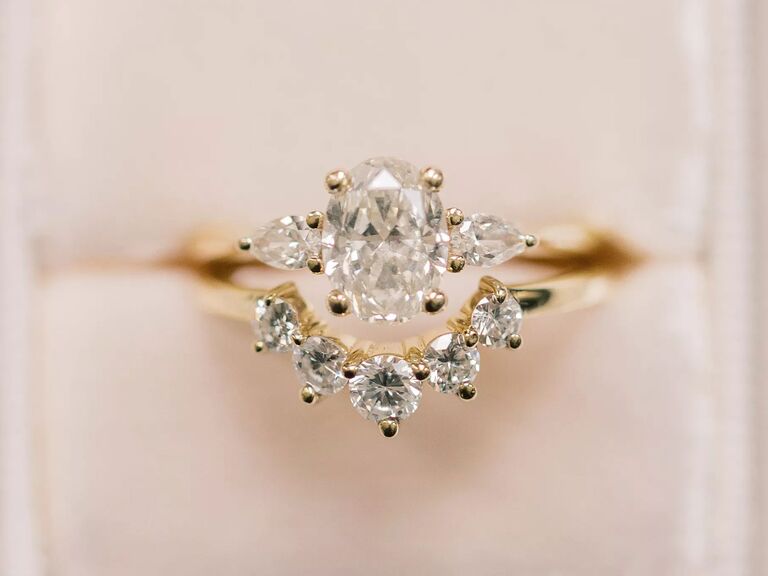 vintage-looking three-stone oval engagement ring 