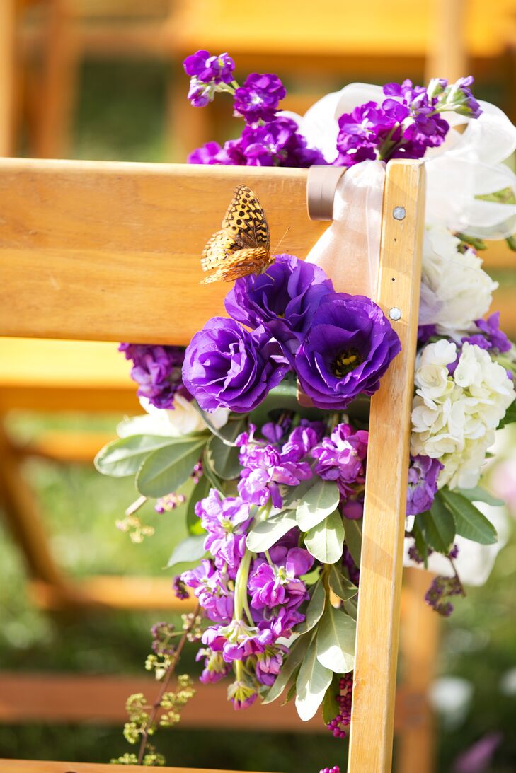 At the ceremony site, purple and cream flowers adorned each row of chairs lining the aisle.