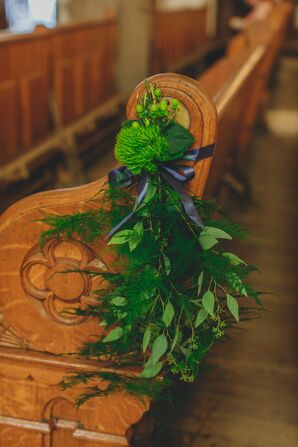 Wood Church Pews Decorated With Greenery