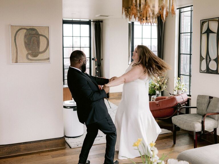 Couple twirls each other around. 