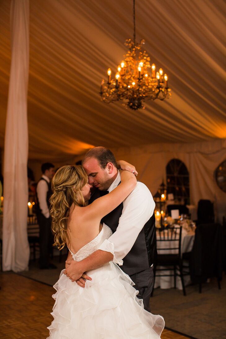Bride and Groom First Dance Under Chandelier