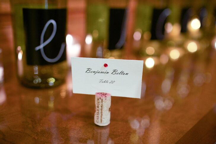 The couple incorporated their love of wine into the wedding by creating DIY centerpieces and escort card holders from recycled bottles and corks.
