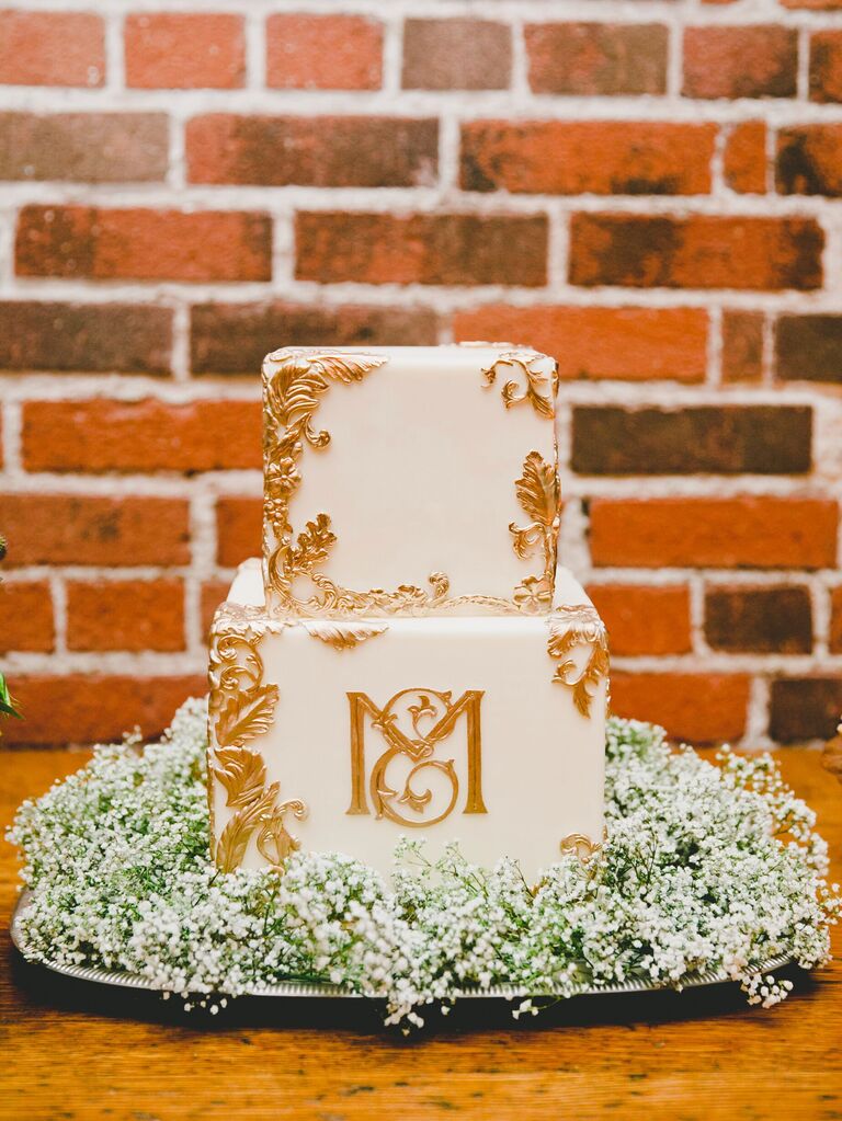 classic square fall wedding cake with gold filigree details and monogram