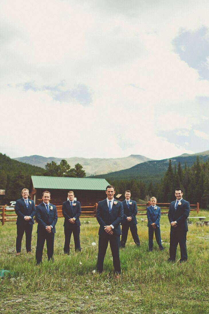 The groomsmen wore textured navy Jos A. Banks suits with black and white checkered shirts and blue ties.
