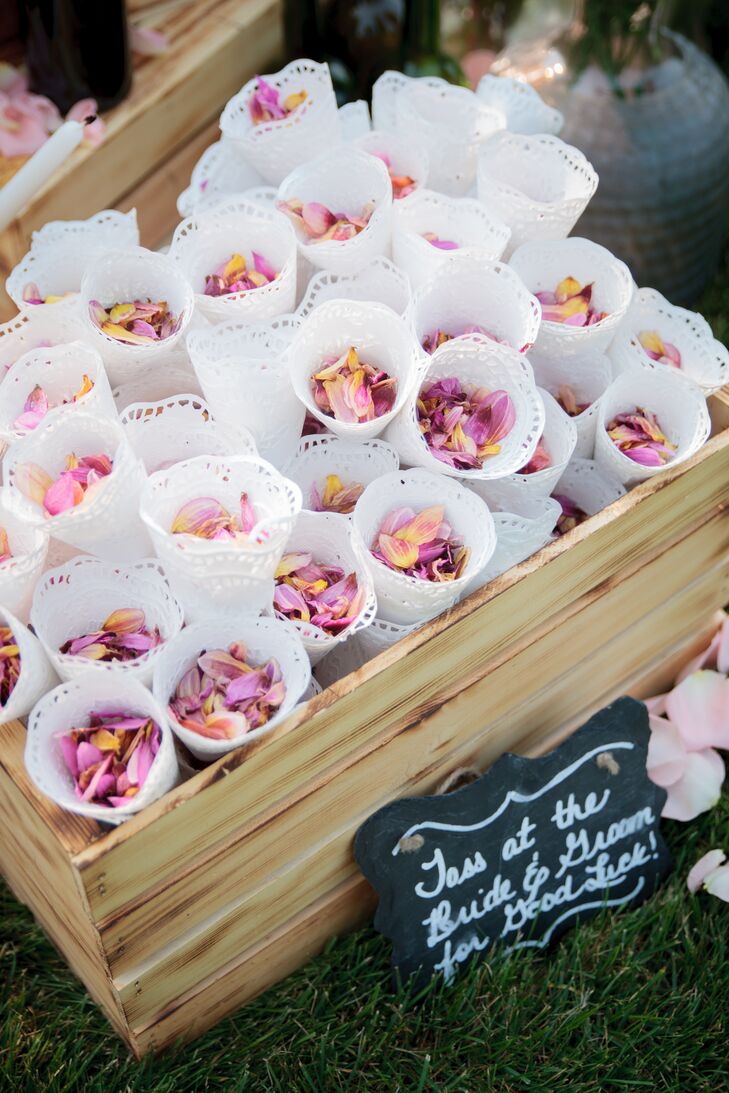 Pink rose petals were gathered in white doily cones to throw at the couple as they exited their ceremony.