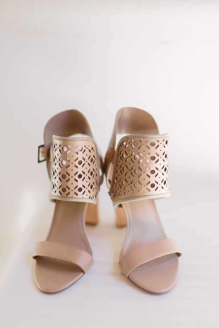 Megan wore one-of-a-kind brown shoes with a thick patterned strap going around the ankles. The neutral color fit in with the rest of the wedding day hues.