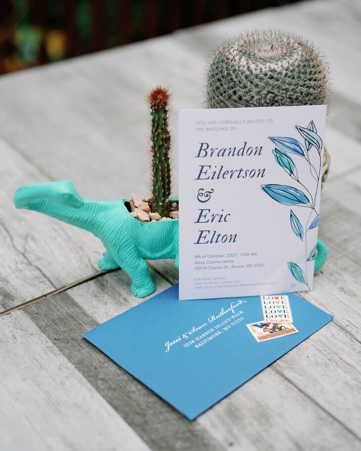Wedding Invitation and Dinosaur Figurine