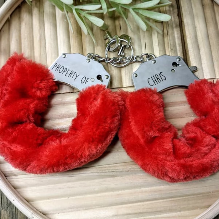 Furry red handcuffs from PrettyInappropriateS on Etsy