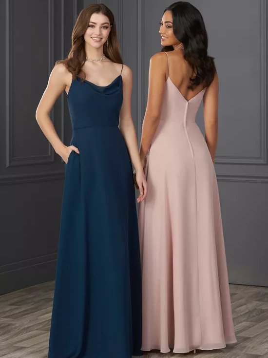 Two models show different color options in a spaghetti strap bridesmaids dress, one in navy and the other in pink.
