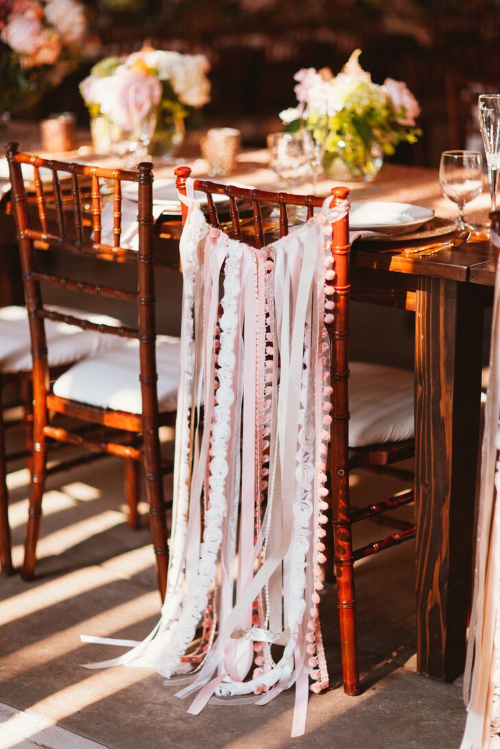 No detail was overlooked when it came to the decor — even the reception chairs. To set their seats apart from the rest, Katherine handmade ribbon bunting for the back of the newlywed chairs, which perfectly reflected the day’s whimsical, romantic feel.