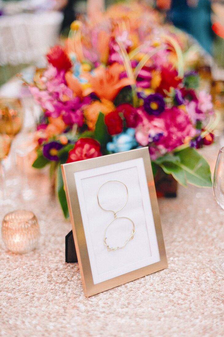 Gold wire was twisted into numbers for unexpected, yet elegant, framed table numbers.