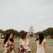 Bride With Bridesmaids in Long Taupe Dresses at BLDG 177 in San Diego, California
