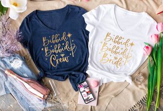 Bibbidi Bobbidi shirts with gold type, bridal party's in blue and bride's in white