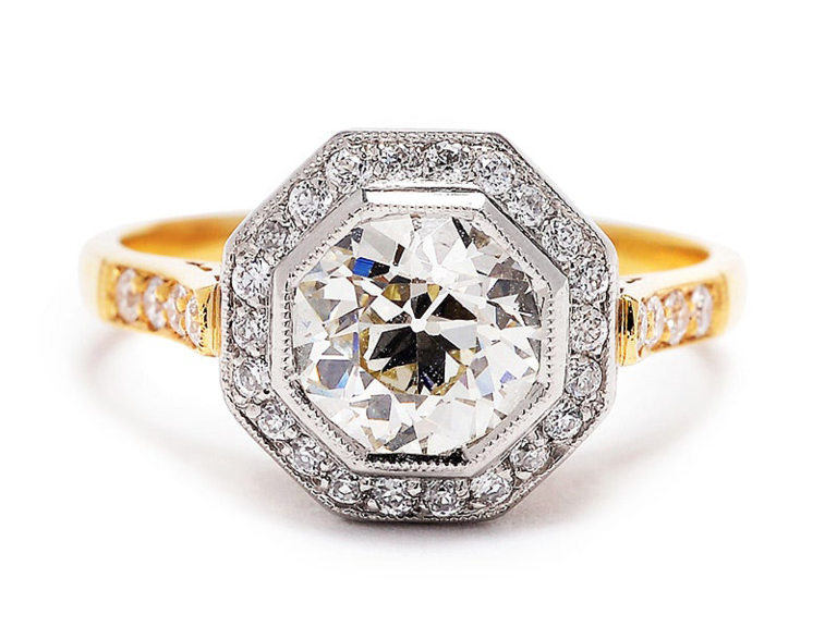 Hexagon center diamond with round diamond halo on gold band