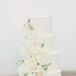 Luxurious Tiered Wedding Cake with Fondant and Flowers