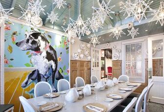 Modern event space with funky light fixtures and colorful artwork. 