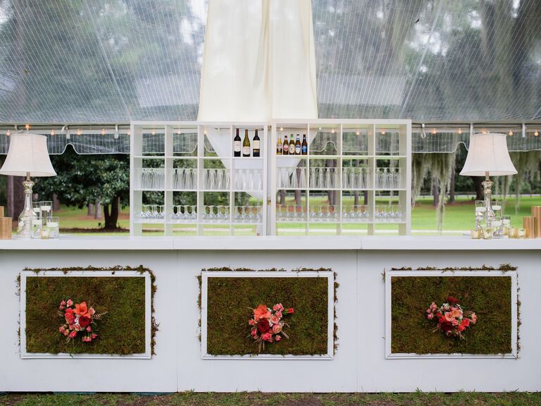 White floral wedding bar at outdoor reception space