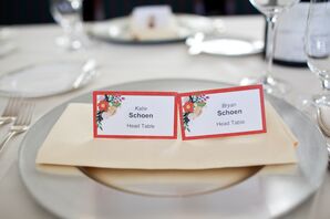 White and Red Escort Cards on Plate