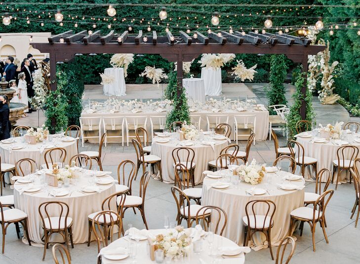 Boho Wedding Reception With Bentwood Chairs at Franciscan Gardens in San Juan Capistrano, California