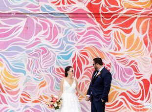 Much like the vibrant murals that surrounded them at The Asbury Hotel in Asbury Park, New Jersey, Lauren and Josh's wedding day was packed with joy, c