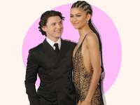 Photo of Tom Holland looking lovingly at girlfriend Zendaya. 