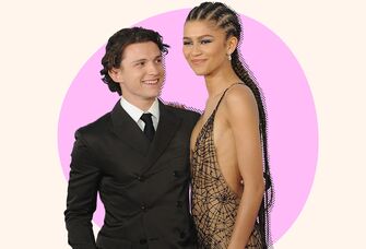 Photo of Tom Holland looking lovingly at girlfriend Zendaya. 