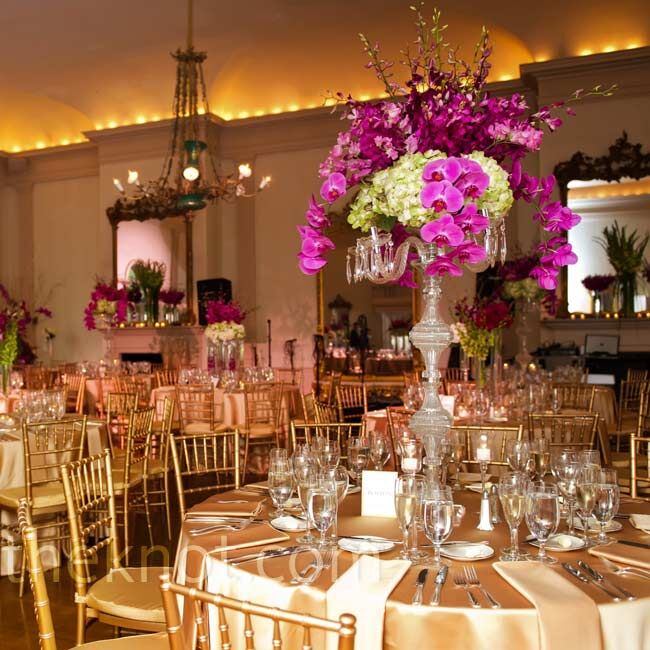 Tall centerpieces of greens and fuchsia orchids made for some dramatic décor.