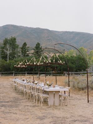 Farm Table and Cross-Back Chairs With Chandeliers at Blue Sky in Wanship, Utah