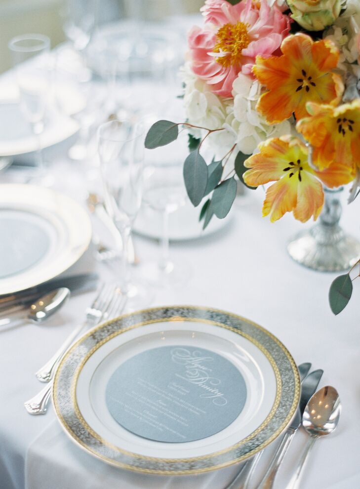 While The Special Event Florist’s eye-catching arrangements of vibrant spring blooms were the stars of Alyse and Dimitry’s decor, more subtle details like M. Haley Design’s elegant stationery were key in bringing the couple’s classic, timeless vision to life. Particularly of note were the silvery gray menu cards displayed on the metallic-edged chargers, which added depth and dimension to each place setting.