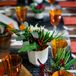 Low Natural Centerpieces and Orange Stemware